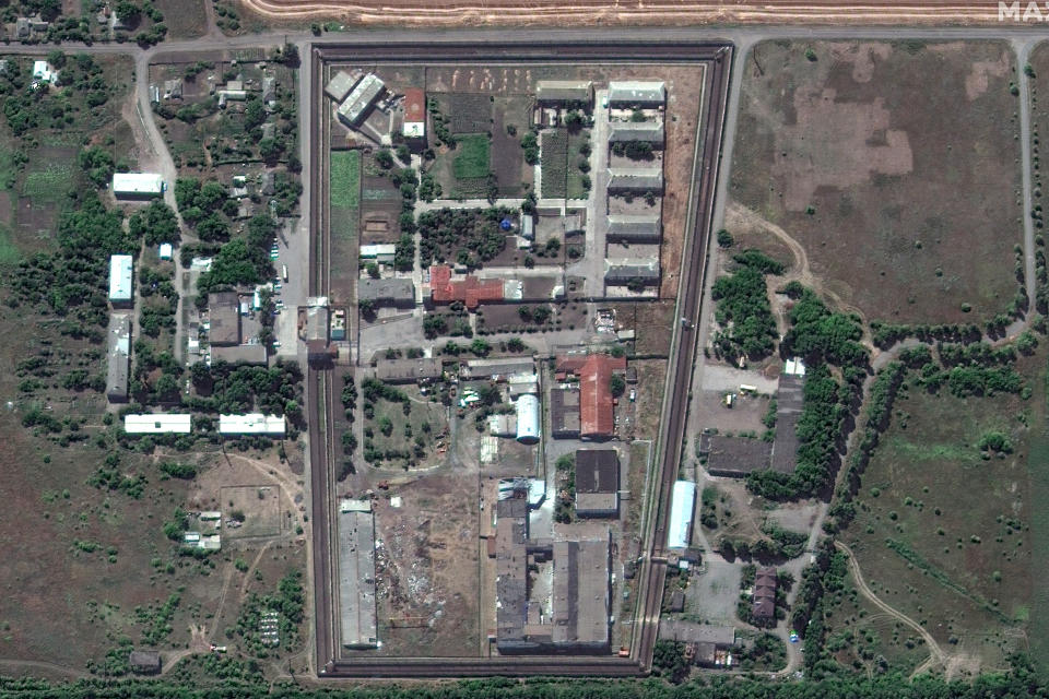 In this satellite photo provided by Maxar Technologies, a view of the Olenivka detention center, in Eastern Donetsk province, after an attack on the prison reportedly killed Ukrainian soldiers captured in May after the fall of Mariupol, a Black Sea port city where troops and the Azov Regiment of the national guard famously held out against a months-long Russian siege. Separatist authorities and Russian officials said the attack killed 53 Ukrainian POWs and wounded another 75. (Satellite image ©2022 Maxar Technologies via AP)