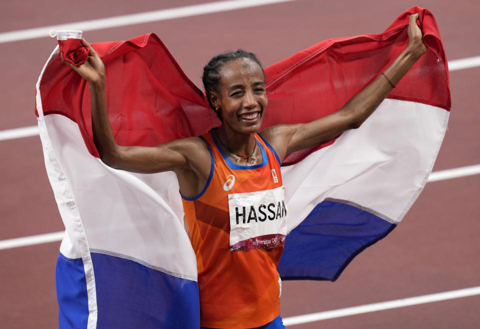 Sifan Hassan, of Netherlands celebrates after winning the gold medal in the final of the women's 10,000-meters at the 2020 Summer Olympics, Saturday, Aug. 7, 2021, in Tokyo, Japan. (AP Photo/Francisco Seco)