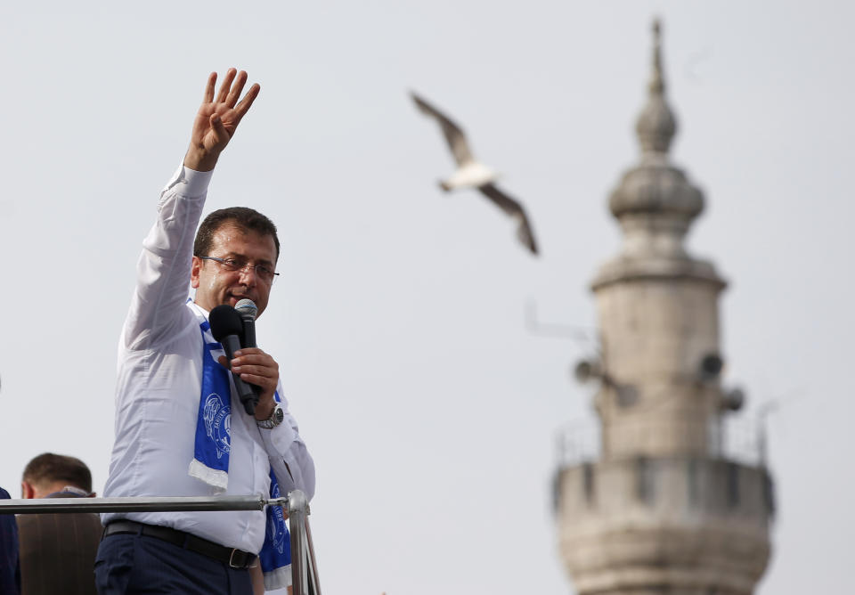 FILE- In this Friday, June 21, 2019 file photo, Ekrem Imamoglu, candidate of the secular opposition Republican People's Party, or CHP, waves to supporters during a rally in Istanbul, ahead of the June 23 re-run of Istanbul elections. Voters in Istanbul return to the polls on Sunday for a rerun of the election for the mayor of the city. (AP Photo/Lefteris Pitarakis, File)