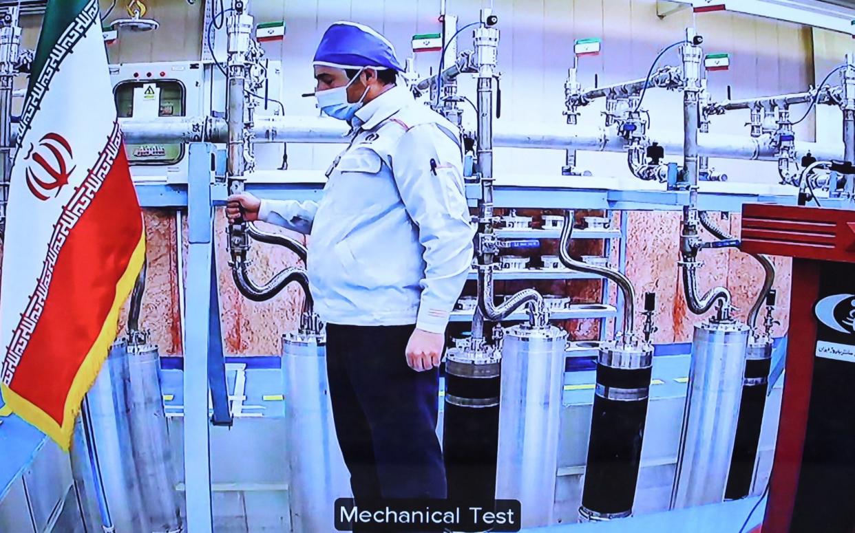 An engineer works in Iran's Natanz uranium enrichment plant in a video shown to government officials on the country's National Nuclear Technology Day in 2019