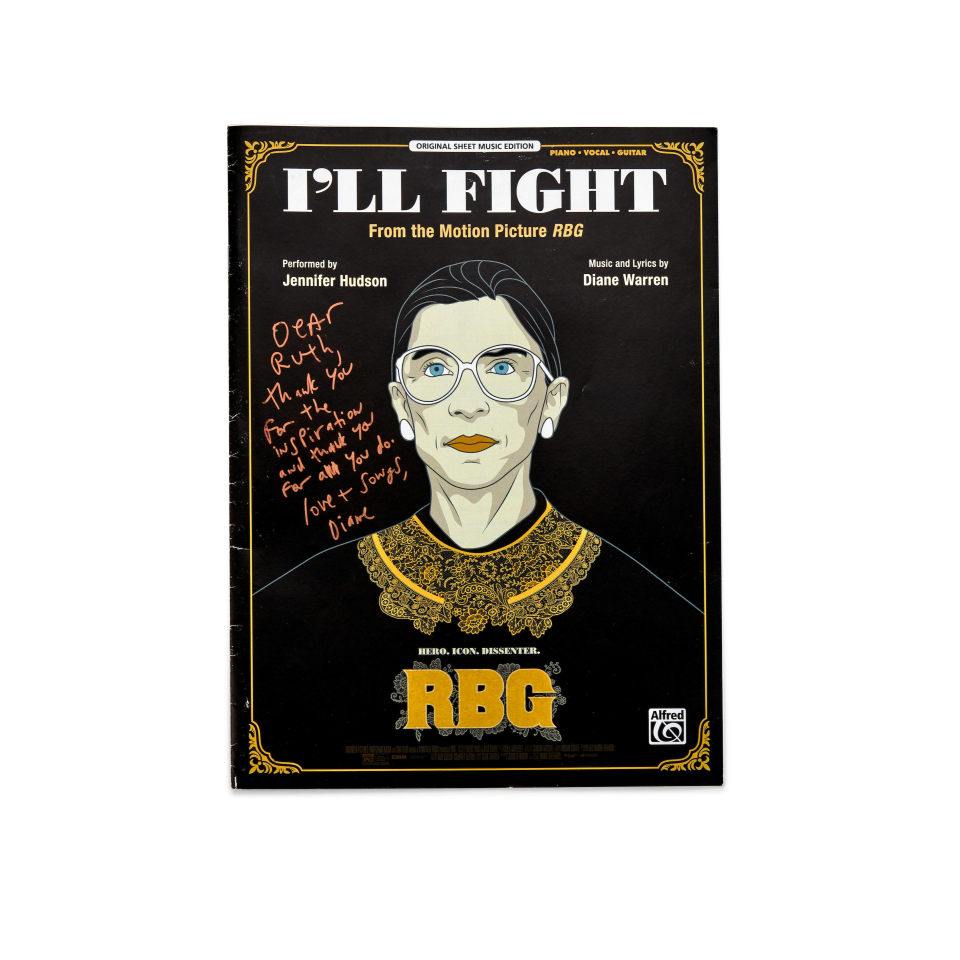 The sheet music for "I'll Fight," inscribed to Ginsburg by Diane Warren, who wrote the song for the 2018 documentary, "RBG," which sold for $35,312.50 (estimate of $100 - 200).  The music was among the items in the auction of the late Supreme Court justice's personal library, which sold at auction for nearly $2.4 million.