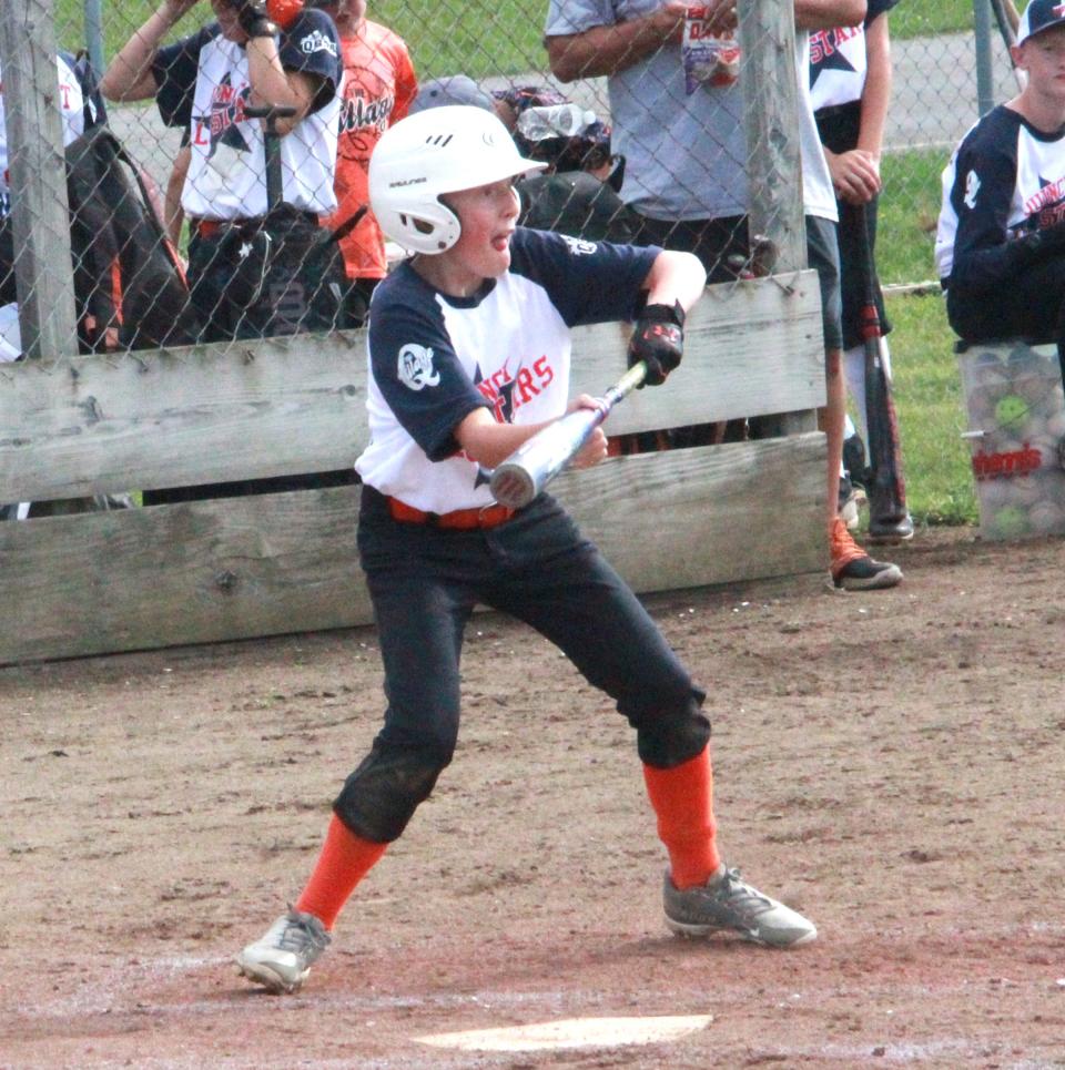 Quincy's Kale Dirschell looks to lay down a bunt versus Coldwater Tuesday night