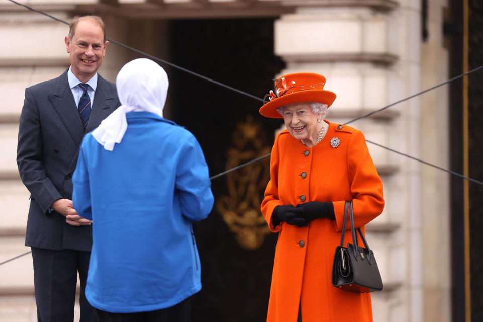 LONDON, ENGLAND - OCTOBER 07: Hometown Hero Haseebah Abdullah delivers The Queen’s message to the stage during the launch of The Queen's Baton Relay for Birmingham 2022, the XXII Commonwealth Games at Buckingham Palace on October 07, 2021 in London, England. 
The Relay will span 294 days, and the Baton will visit all 72 nations and territories of the Commonwealth. (Photo by Chris Jackson/Getty Images for Commonwealth Games Federation / Birmingham 2022 )