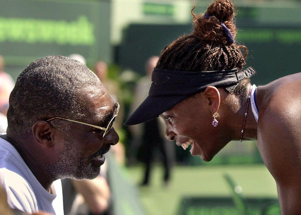The real Venus Williams is congratulated by her father Richard Williams after defeating Jennifer Capriati at the Ericsson Open in March 2001.