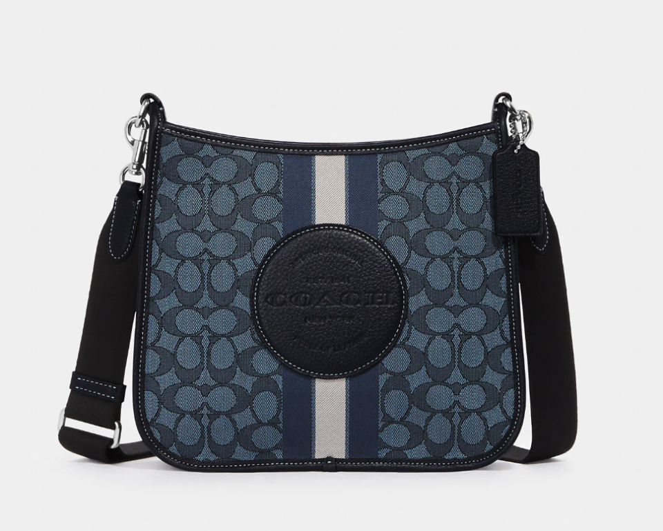 Dempsey File Bag In Signature Jacquard With Stripe And Coach Patch. Image via Coach Outlet.