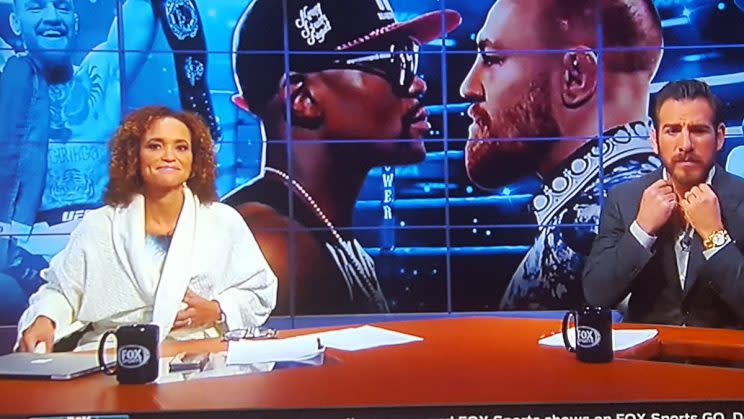 Fox broadcaster Karyn Bryant shown wearing a robe on live TV due to a FOX Sports producing glitch during the Floyd Mayweather-Conor McGregor press conference(Twitter)