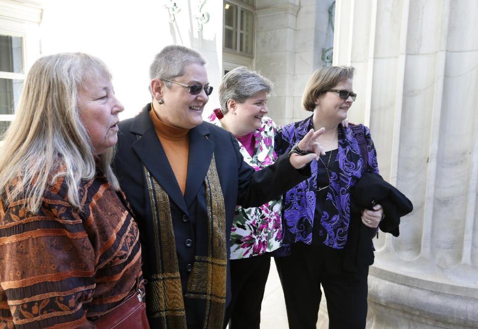 Plaintiffs challenging Oklahoma's gay marriage ban arrive in court following a hearing at the 10th U.S. Circuit Court of Appeals in Denver, Thursday, April 17, 2014. They are, left to right, Dr. Gay Phillips, her partner Sue Barton, Sharon Baldwin and her partner Mary Bishop. The court is to decide whether to overturn a federal judge's decision to strike down. (AP Photo/Brennan Linsley)