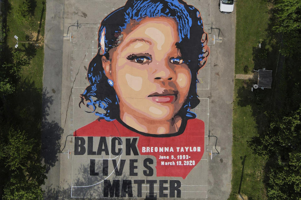 FILE - A ground mural depicting a portrait of Breonna Taylor is seen at Chambers Park in Annapolis, Md., July 6, 2020. The ex-Louisville officer who fatally shot Breonna Taylor during a botched police raid took the witness stand Friday, Nov. 3, 2023, and criticized the actions of a former officer who is on trial on charges of violating Taylor’s civil rights. (AP Photo/Julio Cortez, File)