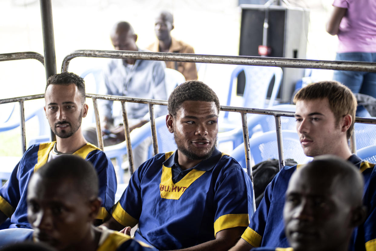 CORRECTS ID: Benjamin Reuben Zalman-Polun, left, Marcel Malanga and Tyler Thompson, all American citizens, attend a court verdict in Congo, Kinshasa, Friday Sept. 13, 2024, on charges of taking part in a coup attempt in May 2024. (AP Photo/Samy Ntumba Shambuyi)