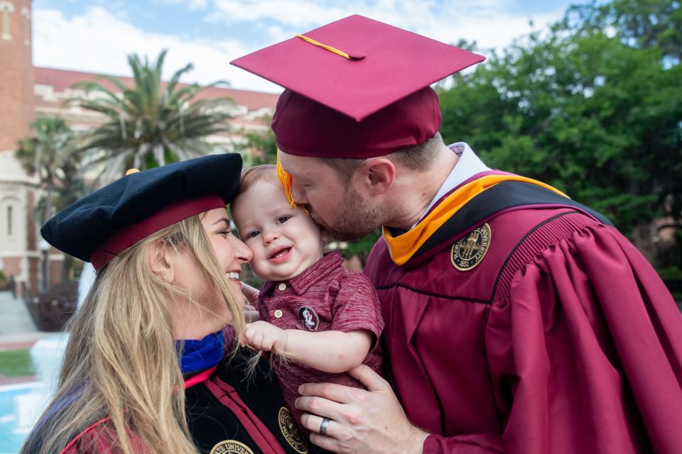 Rachel and Josh Duke spend time with their son, Arthur, on the Florida State University campus on Tuesday, April 30, 2024. The couple is ending their time at FSU with two degrees, a dissertation and a baby after a challenging few years.