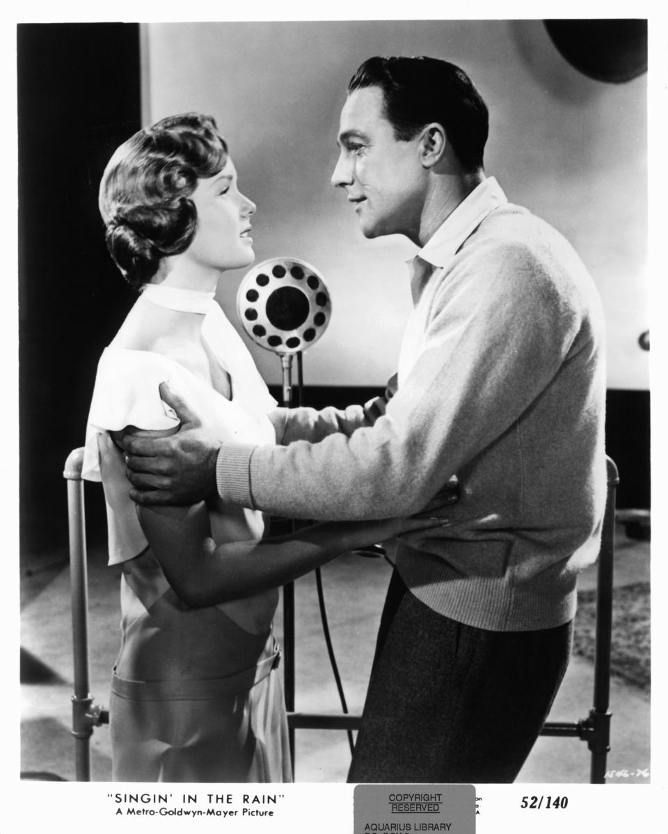 Debbie Reynolds holds Gene Kelly in a scene from the film 'Singin' In The Rain', 1952