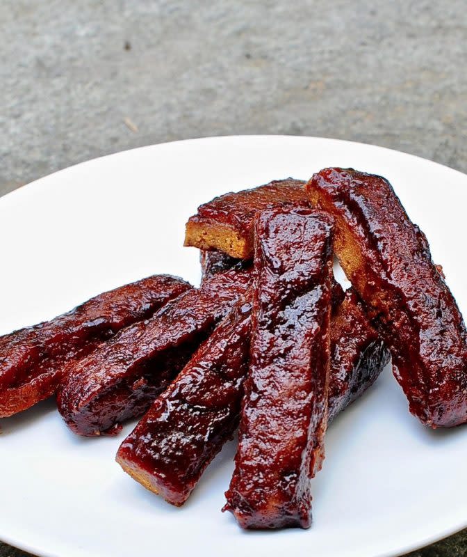 <p>Sunny Side Hanne</p><p>These BBQ vegan seitan ribs with sticky tamarind BBQ sauce will please even the most committed meat eater! Toothsome, mouthwatering and protein-rich, these vegan ribs are simply delectable.</p><p><strong>Get the recipe: <a href="https://www.sunnysidehanne.com/bbq-vegan-ribs-sticky-tamarind-bbq-sauce/" rel="nofollow noopener" target="_blank" data-ylk="slk:BBQ Vegan Seitan Ribs with Sticky Tamarind BBQ Sauce;elm:context_link;itc:0;sec:content-canvas" class="link rapid-noclick-resp">BBQ Vegan Seitan Ribs with Sticky Tamarind BBQ Sauce</a></strong></p>