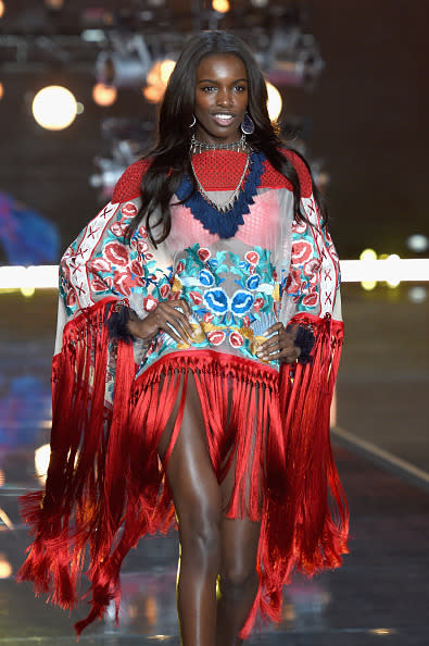 Leomie Anderson wore a poncho during the 2015 Victoria’s Secret Fashion Show.