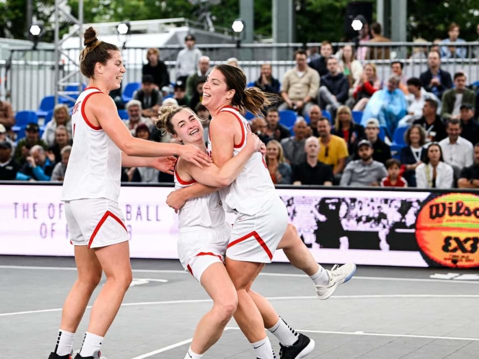 Canada's Michelle Plouffe, Canada's Paige Crozon and Canada's Katherine Plouffe, seen above in June at the World Cup, are hoping to qualify for three-on-three basketball at the 2024 Paris Olympics. (Tom Goyvaerts/Belga Mag/AFP via Getty Images - image credit)