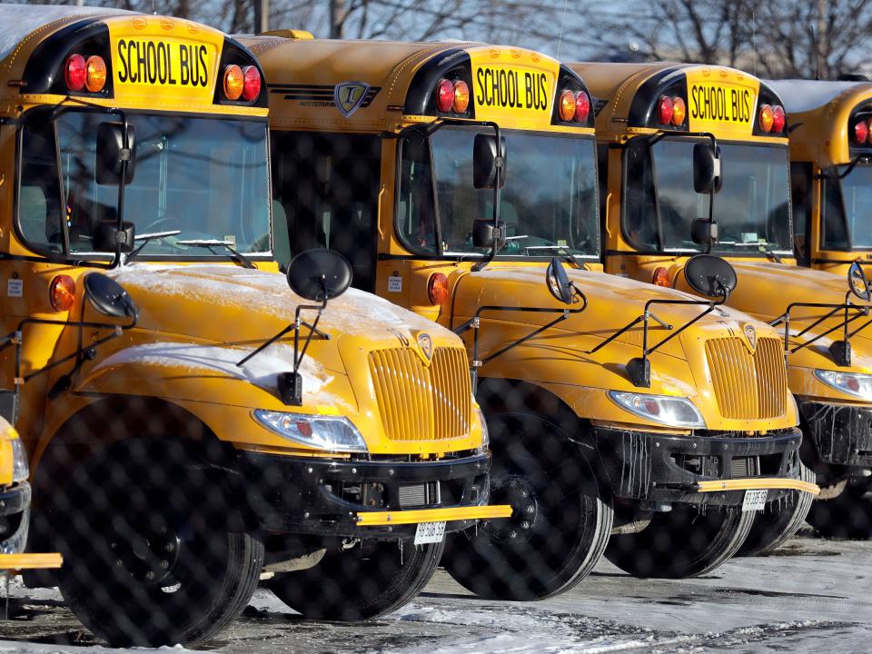 School buses parked in a row.