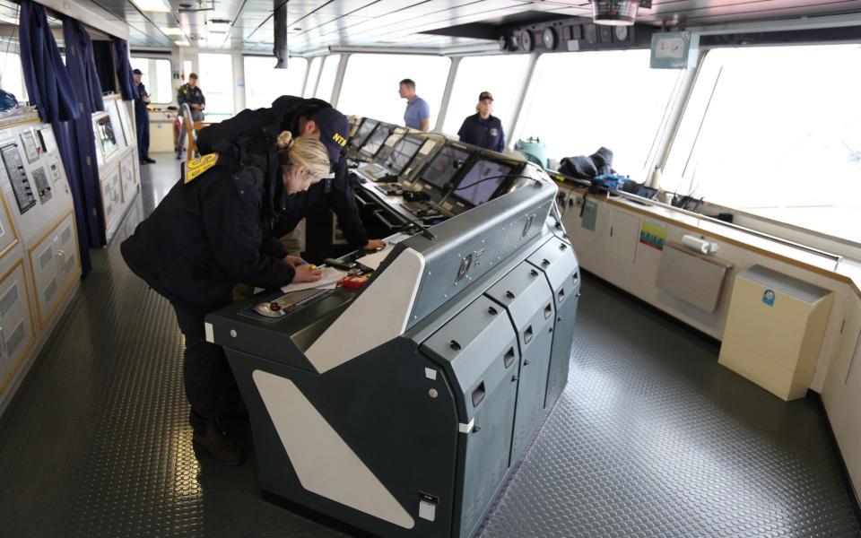 NTSB investigators on the bridge of the cargo vessel Dali