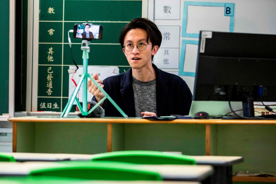 A teacher records a video lesson for his students in Hong Kong in early March 2020.