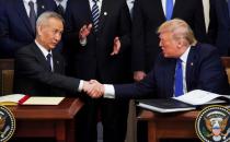 Chinese Vice Premier Liu He and U.S. President Donald Trump shake hands after signing "phase one" of the U.S.-China trade agreement at the White House in Washington