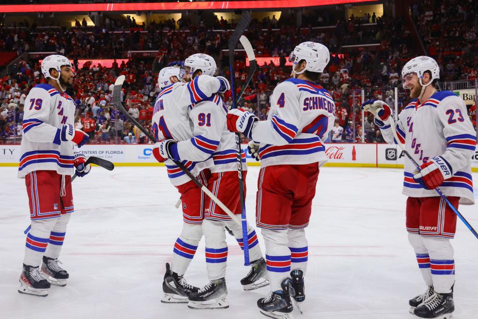 May 26, 2024; Sunrise, Florida, USA; New York Rangers center Alex Wennberg (91) hugs center Barclay Goodrow (21) after scoring aa game-winning goal in overtime against the Florida Panthers in game three of the Eastern Conference Final of the 2024 Stanley Cup Playoffs at Amerant Bank Arena. Mandatory Credit: Sam Navarro-USA TODAY Sports