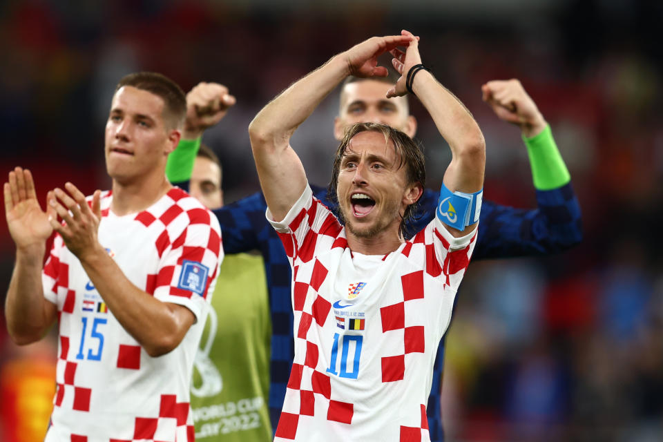 Seen here, Luka Modric celebrates after Croatia booked its spot in the World Cup knockout stages with a 0-0 draw against Belgium.