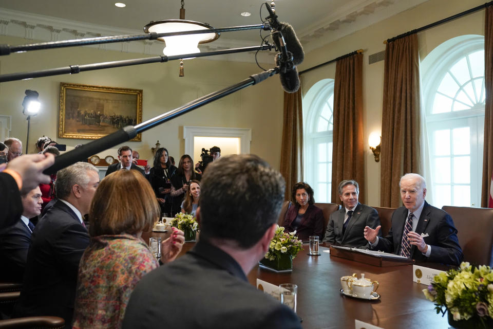 President Joe Biden meets with Colombian President Ivan Duque Marquez in the Cabinet Room of the White House, Thursday, March 10, 2022, in Washington, as Commerce Secretary Gina Raimondo and Secretary of State Antony Blinken listen. (AP Photo/Patrick Semansky)