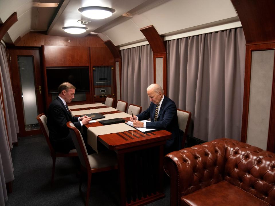 President Joe Biden sits on a train with National Security Advisor Jake Sullivan after a surprise visit with Ukrainian President Volodymyr Zelenskyy in Kyiv