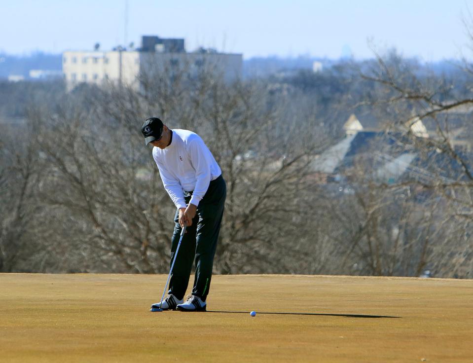 A golfer putts on one of the greens at KickingBird Golf Club in Edmond in this 2016 file photo.