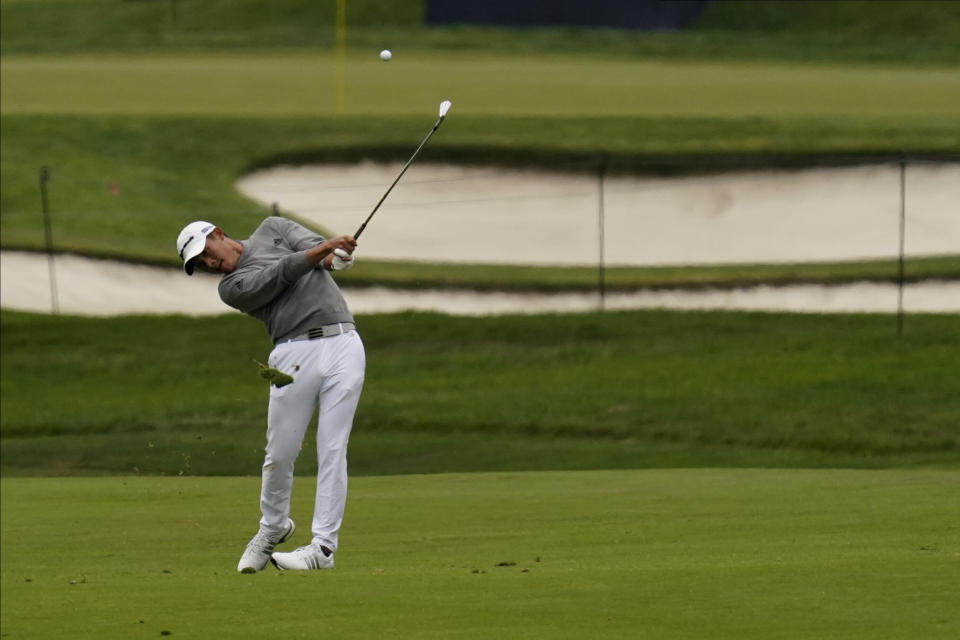 Collin Morikawa hits from the fairway on the second hole during the final round of the PGA Championship golf tournament at TPC Harding Park Sunday, Aug. 9, 2020, in San Francisco. (AP Photo/Jeff Chiu)