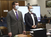 Deputy alternate defender Thomas Nocella, left, and attorney Randy Bethune address Orange County Superior Court Judge Larry Yellin during a hearing for Marcus Eriz and Wynne Lee at the Central Justice Center in Santa Ana, Claif., Friday, June 18, 2021. Eriz, 24, and Wynne Lee, 23, both pleaded not guilty to the charges they face due to a road rage incident through their attorneys. Eriz, not seen, charged with the murder of a 6-year-old boy in the road rage incident was ordered held without bail Friday. (Frederick M. Brown/Pool via AP)