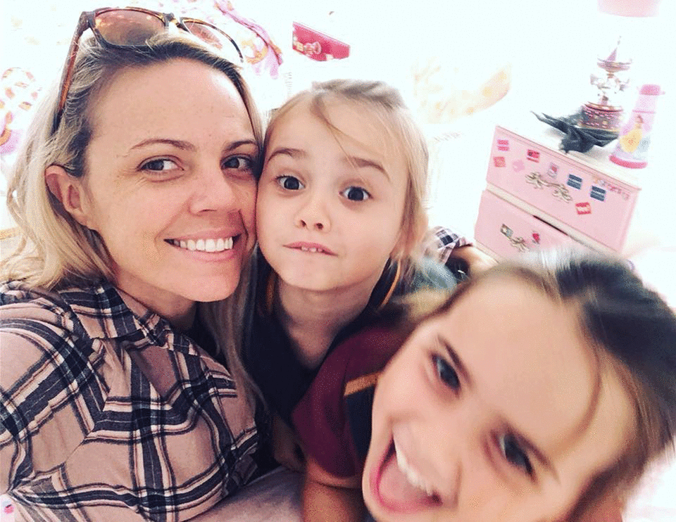 Penny Brand (pictured with her daughters) first noticed pain a few months after giving birth to her first child. Photo: Supplied