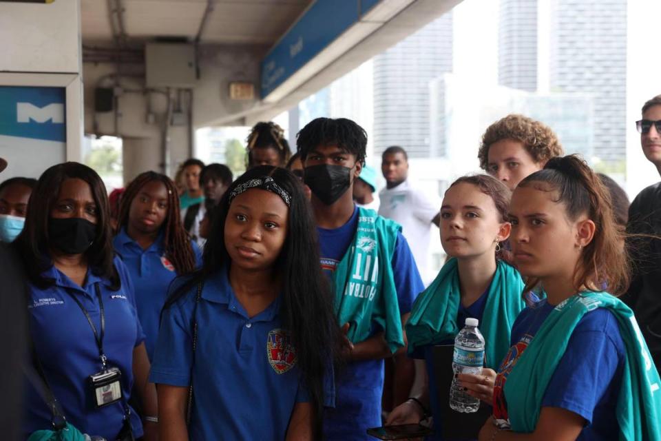 Students from Miami PAL, Miami Police Athletic League, listen during a historic walking tour of Downtown Miami with the Miami Dolphins rookie class on Wednesday, June 15, 2022, beginning with tour leaders at the History Miami Museum.