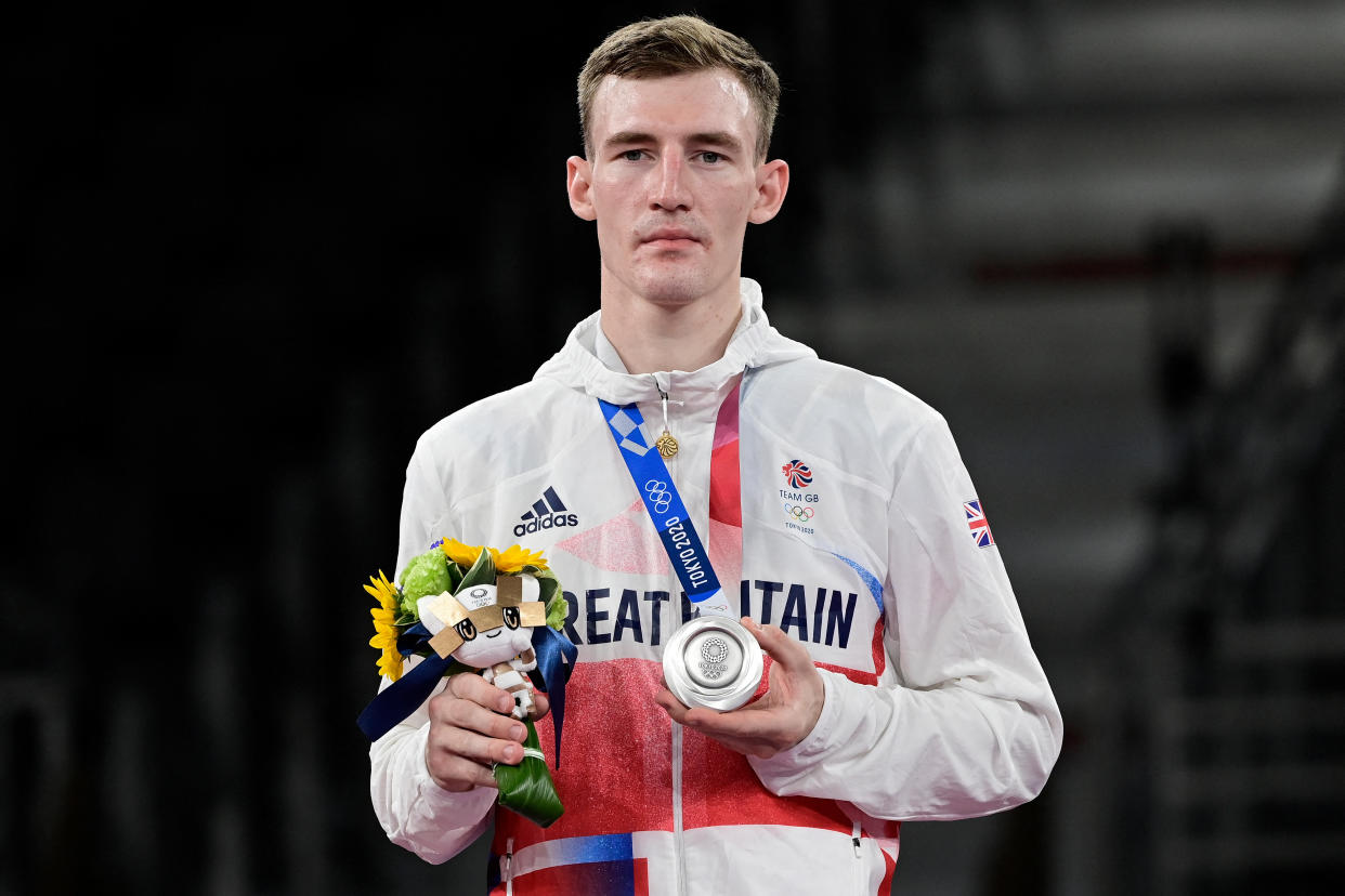 Silver medalist Britain's Bradly Sinden poses on the podium after the taekwondo men's -68kg bouts during the Tokyo 2020 Olympic Games at the Makuhari Messe Hall in Tokyo on July 25, 2021. (Photo by Javier SORIANO / AFP) (Photo by JAVIER SORIANO/AFP via Getty Images)