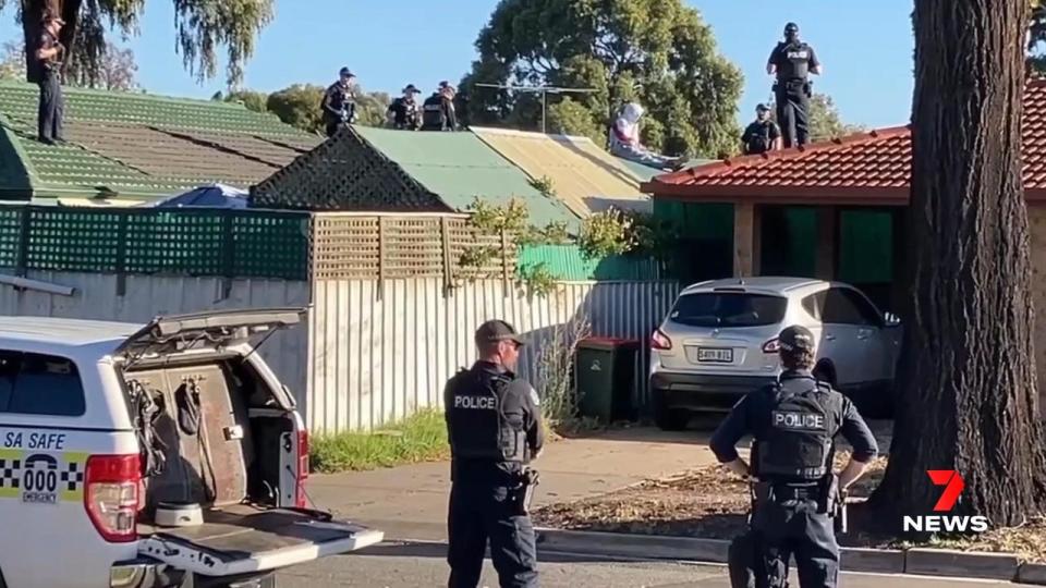 STAR Group officers surrounded a Paralowie home where a wanted suspect wanted over a rideshare vehicle carjacking was holed up. Picture 7NEWS