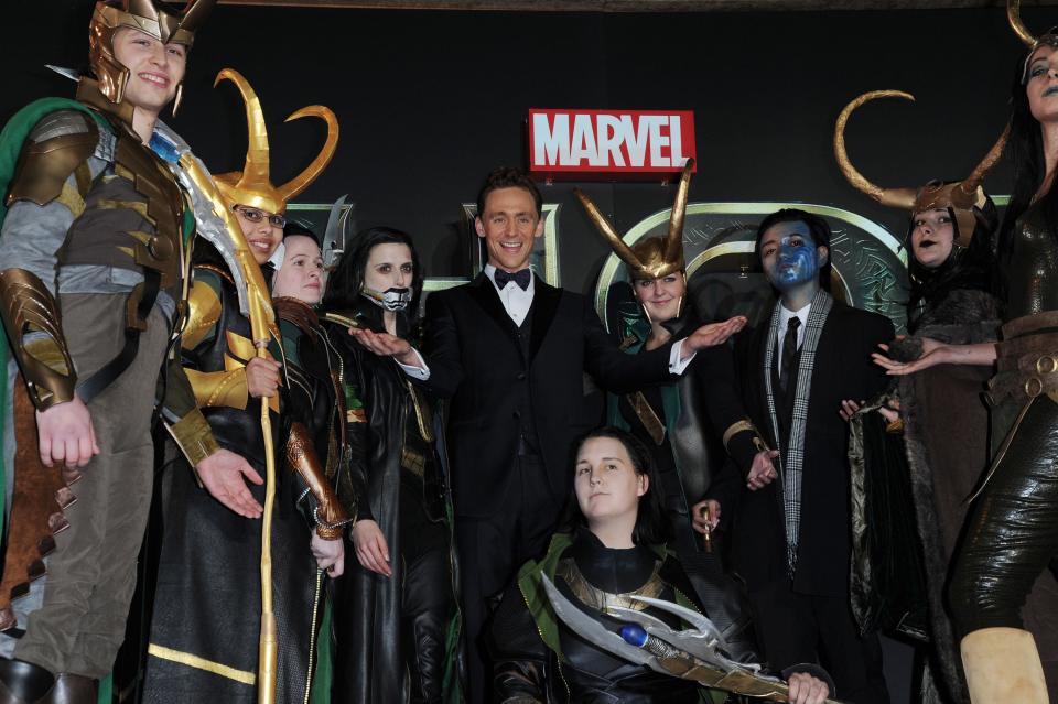 Tom Hiddleston at the premiere of ‘Thor: The Dark World’, surrounded by people dressed as Loki, on 22 October 2013 in London (Shutterstock)