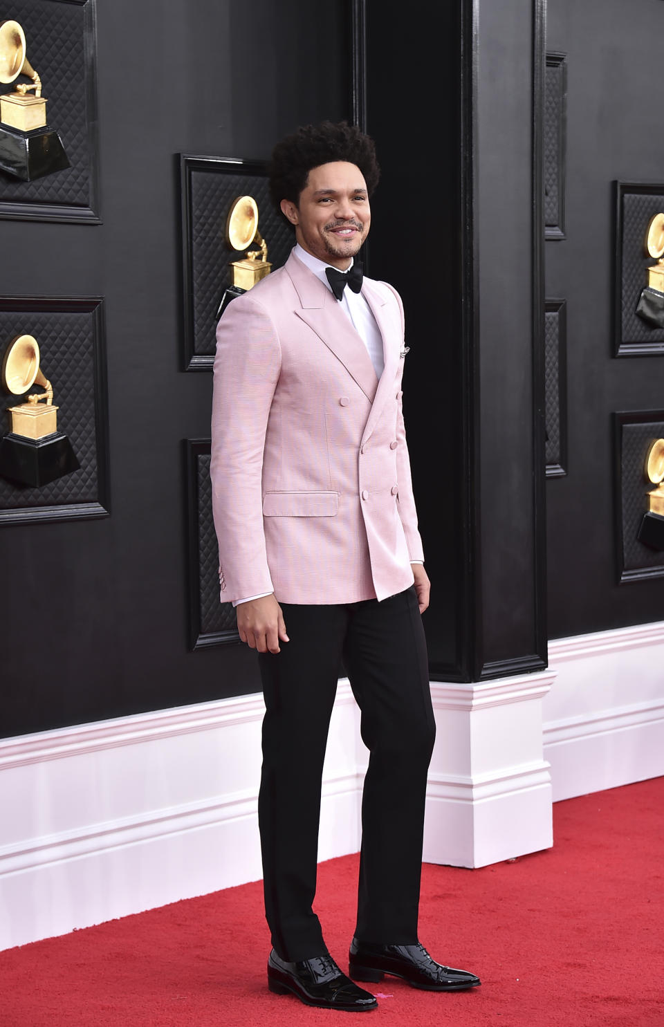 Trevor Noah arrives at the 64th Annual Grammy Awards at the MGM Grand Garden Arena on Sunday, April 3, 2022, in Las Vegas. (Photo by Jordan Strauss/Invision/AP)