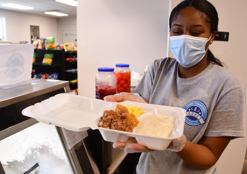 Line cook Janasia Sneed prepares healthy, hot deli foods and breakfast meals to go. The Evans Center and market is a vital hub to a low to moderate income area in Melbourne and Palm Bay. The Evans Center provides a community Room, Brevard Health Alliance office and a full service market and grocery offering groceries as well as healthy meals. 