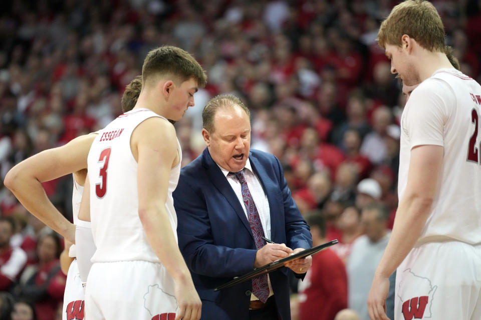 Feb 4, 2024; Madison, Wisconsin, USA; Wisconsin Badgers head coach Greg Gard talks with his players during the second half against the Purdue Boilermakers at the Kohl Center. Mandatory Credit: Kayla Wolf-USA TODAY Sports