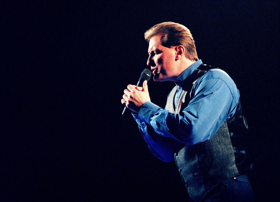 Collin Raye performs during the 30th annual CMA Awards show at the Opry House on Oct. 2, 1996.