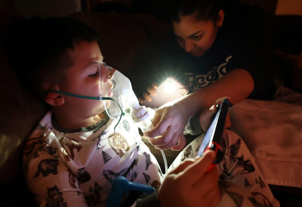 Rosa Mandujano checks on her son Ruben Mandujano’s nebulizer at their home near the Salton Sea and Mecca, California, on Thursday, Dec. 14, 2023. Ruben, 5, has asthma and is autistic. He doesn’t like the nebulizer, which administers albuterol, as it often makes him throw up. | Kristin Murphy, Deseret News