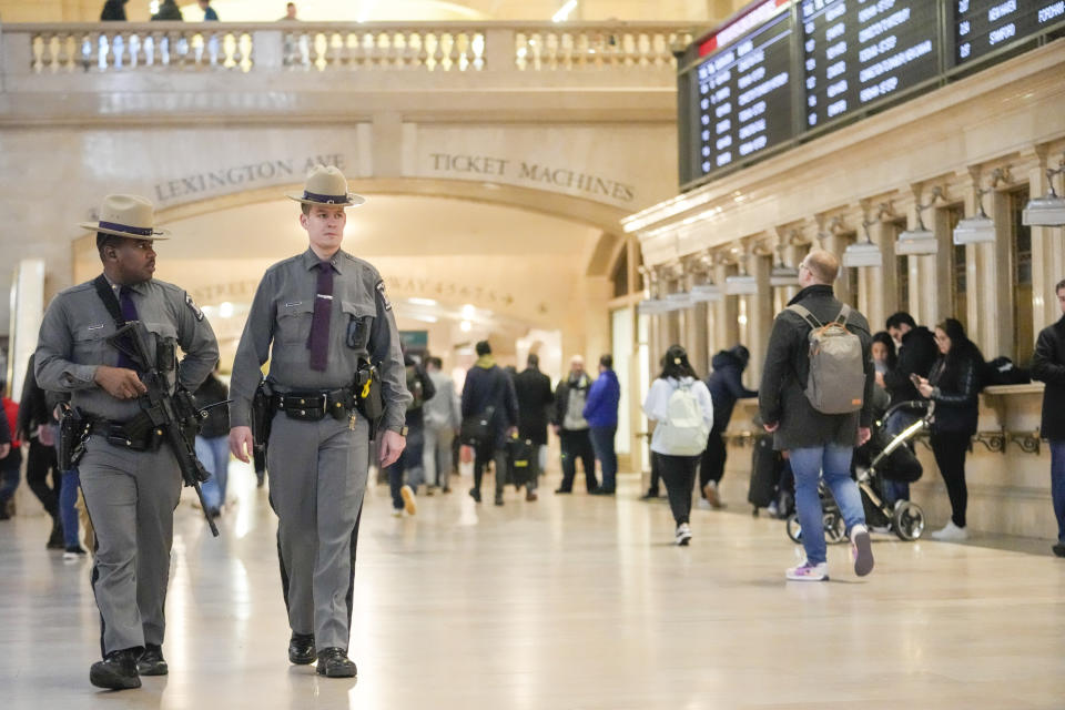 A couple of heavily armed New York State troopers patrol Grand Central terminal, Thursday, March 7, 2024, in New York. New York Gov. Kathy Hochul announced plans Wednesday to send the National Guard to the New York City subway system to help police conduct random searches of riders' bags for weapons following a series of high-profile crimes on city trains. (AP Photo/Mary Altaffer)