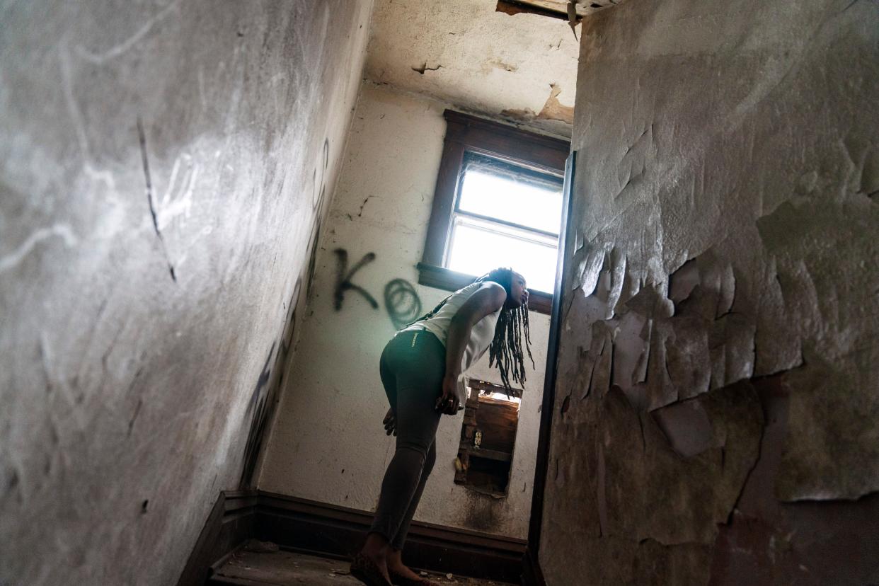 An overdose response team looks around an abandoned home in West Virginia (Associated Press)