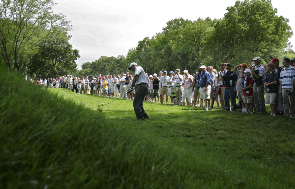 FILE - In this June 12, 2006, file photo, Tiger Woods hits from the rough on the fifth hole during a practice round for the U.S. Open golf tournament at Winged Foot Golf Club in Mamaroneck, N.Y. Woods returns to Winged Foot for the U.S. Open next week. It's the site of his first missed cut in a major. (AP Photo/Mel Evans, File)