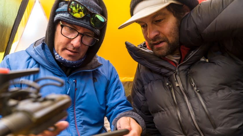 Lost on Everest -- National Geographic TV Special, Mark Synnott and Renan Ozturk look at a GPS path for the drone during an expedition to find Sandy Irvine's remains on Mt. Everest. (National Geographic/Matt Irving) Mark Synnott, left, and Renan Ozturk in "Lost on Everest" on National Geographic.