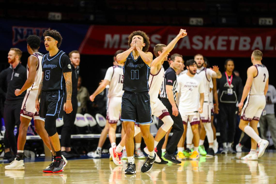 Kamrin Oriol, right, and Jordan Caruso of The Master’s react after coming up short against Freed-Hardeman, 69-68, in Thursday’s first game at the 2024 NAIA Men’s Basketball National Championship at Municipal Auditorium in Kansas City.