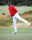 U.S. team player Dustin Johnson watches his putt on the 8th green during their fourball match at the Royal Melbourne Golf Club in the opening rounds of the President's Cup golf tournament in Melbourne, Thursday, Dec. 12, 2019. (AP Photo/Andy Brownbill)