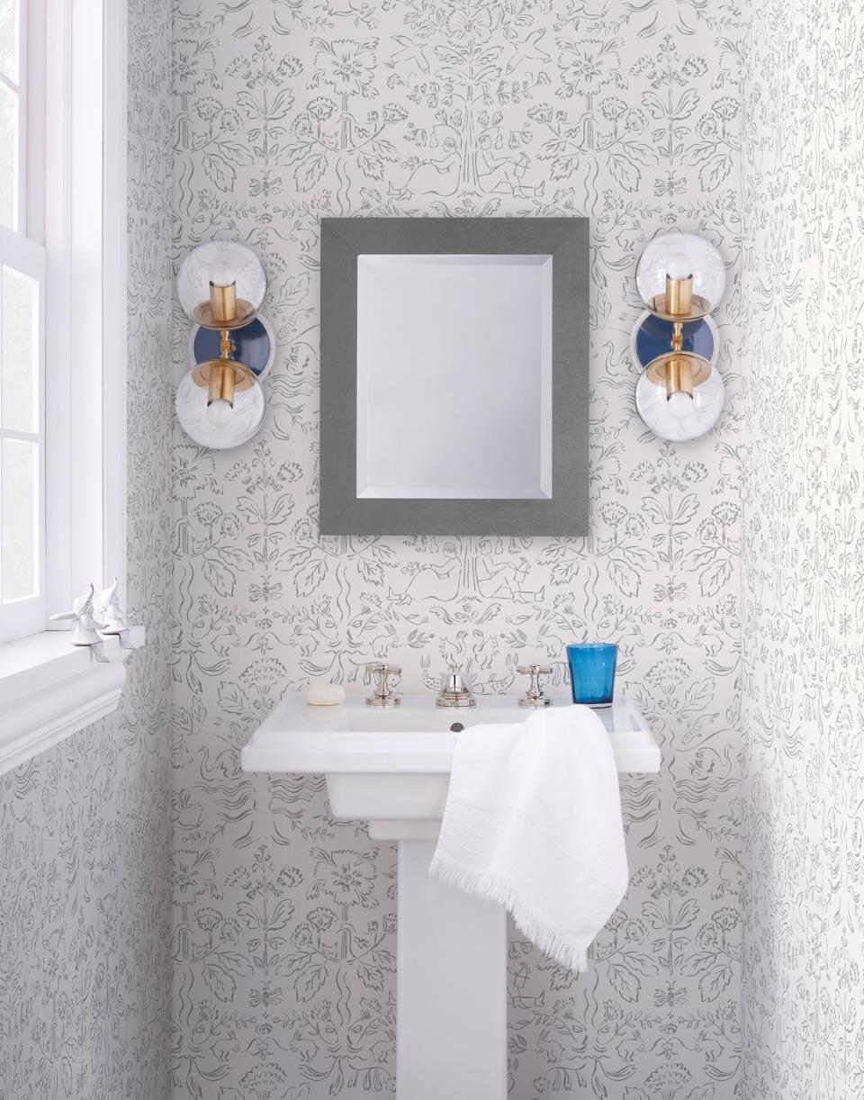 This photo provided by Hygge & West shows Storyline Wallpaper in white. In lighting fixtures, wallpapers, bedding and wall art, floral design is having a big year in 2020. There's also a renewed interest in flower arranging and floral-inspired table settings. (Hygge & West via AP)