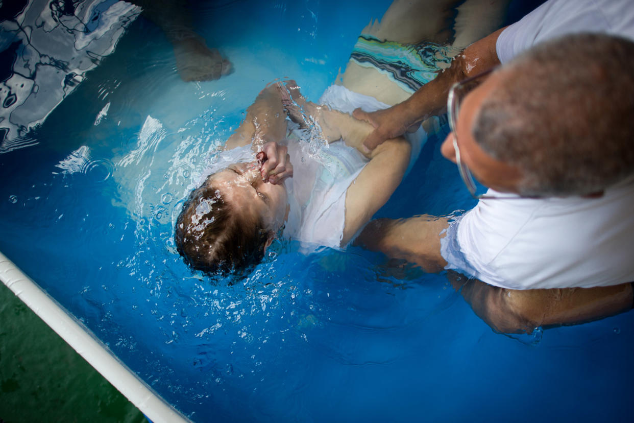 Faith ban: A stock image of a Jehovah's Witnesses' baptism: AFP/Getty Images