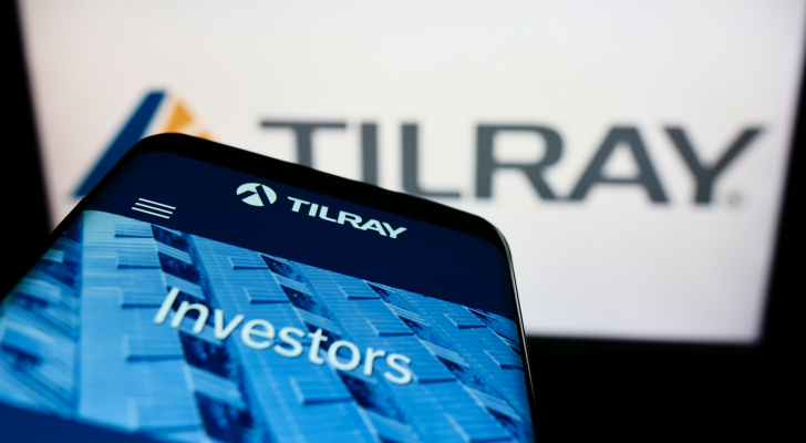 Mobile phone with webpage of Canadian cannabis company Tilray (TLRY) Inc. on screen in front of business logo. Focus on top-left of phone display. Unmodified photo.