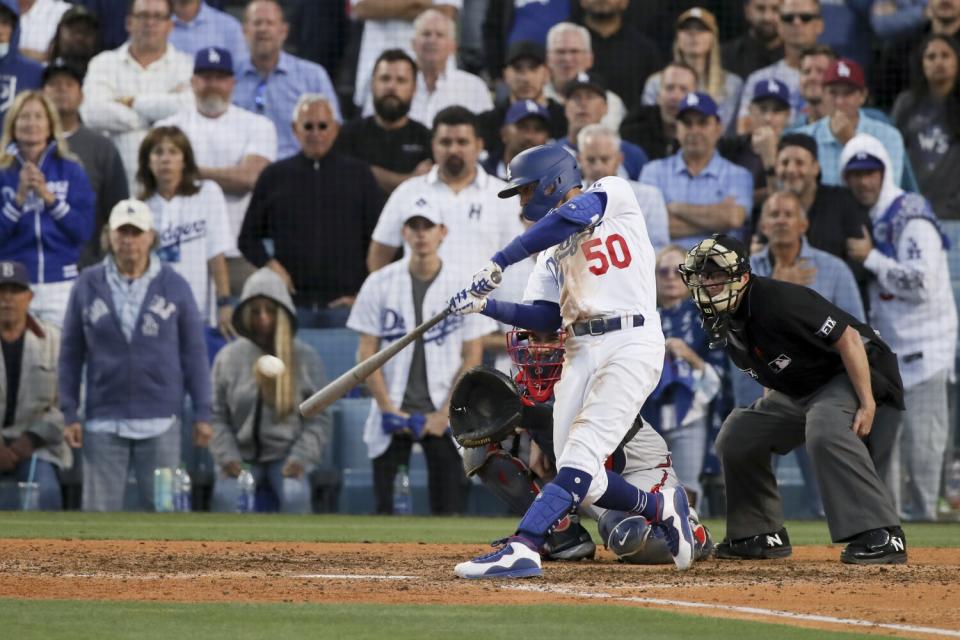 Mookie Betts doubles in the go-ahead run in the eighth inning of the Dodgers' 6-5 win Tuesday.