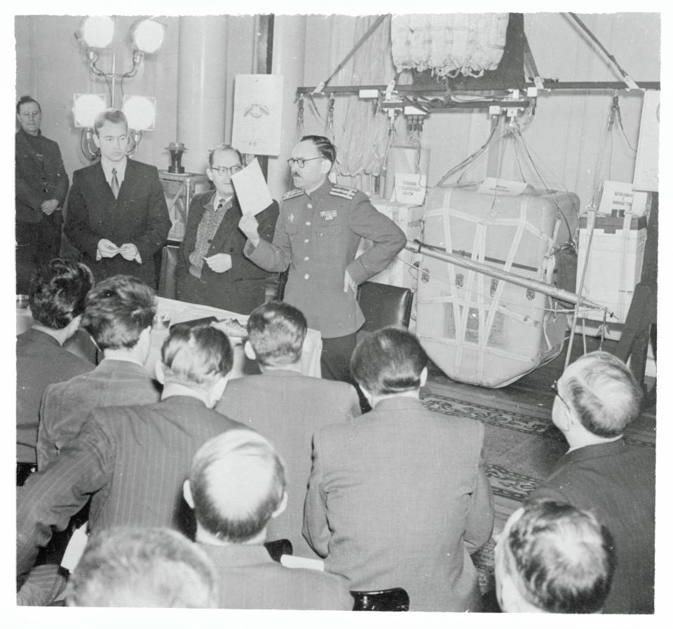 A Russian colonel holds up a piece of paper during a press conference discussing the US’s tactic of sending balloons over its country